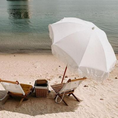 China Scandinavian Sun Luxury White Bohemian Vintage Wooden Beach Umbrella With Tassels Recycled Boho Beach Umbrella for sale