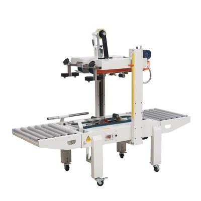 China FXA6050S Food Carton Sealer Box Sealing Packaging Machine With Bottom Conveyor for sale