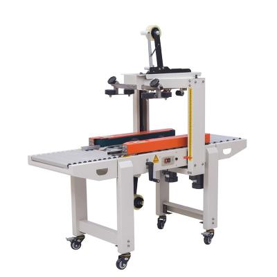 China Food Goods Using Easy To Operate Small Automatic Carton Box Packing Machine With Side Belt Conveyor for sale