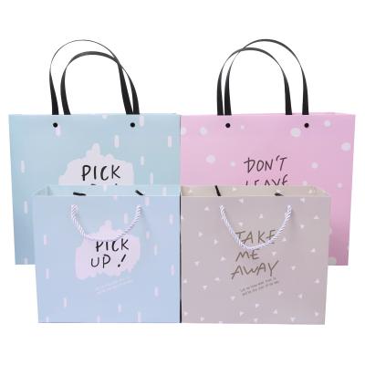 China Recycled Materials Rivet Reinforcement Food Kraft Paper Bag Cardboard Portable Shopping Bag White Luxury for sale