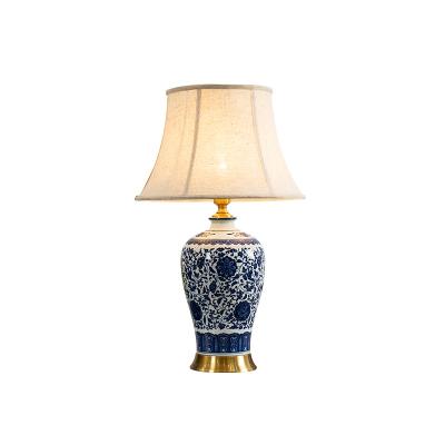 China Modern hot sale blue porcelain Chinese handmade copper base and white led lamp ceramic body table lamps for living room for sale