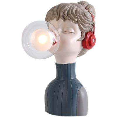 China Modern cartoon bubble fashion resin blowing girl with headphones table lamp children room bedside girl lovely lead glass lampshade for sale