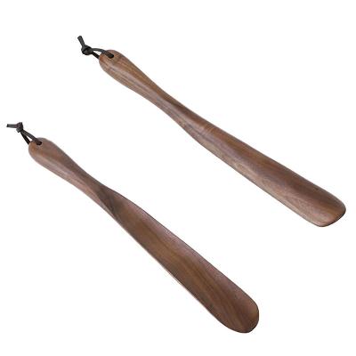 China Wholesale Durable Reusable Wooden Household Shoe Pusher Hotel Long Handle Solid Wood Shoe Horn for sale