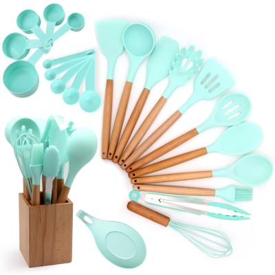 China Amazon sustainable hot selling silicone kitchen utensil set non stick cookware sets kitchen cookware set with wooden handles for sale