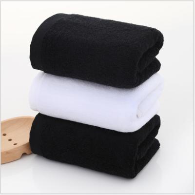 China Compressed Custom Black Hotel White Logo Embroidery 100% Cotton Bath Towel for sale