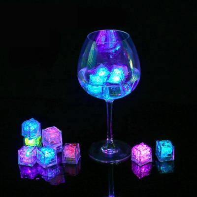 China Indoor And Outdoor Decorative Plastic Party LED Ice Cube Light Multicolor Liquid Sensor Ice Cubes for sale