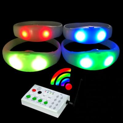 China It Flash By One Controller Glow Sticks Bulk Wristband Dmx Xyloband LED Remote Control Wristband Light for sale