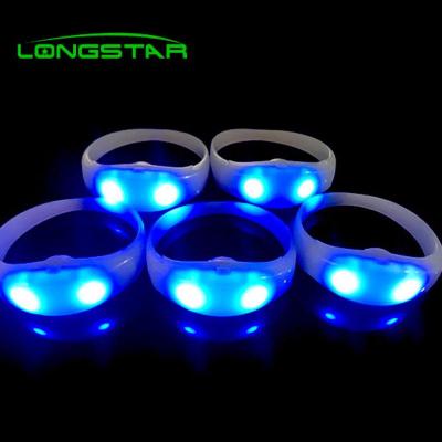 China Change Color Every Time You Press New Button 2021 Luxury LED Wristband Concerts Party DMX LED Remote Controlled Flashing Wristband for sale