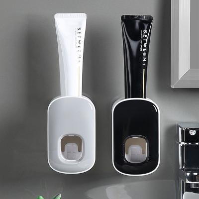 China Bathroom Purposed Storage Rack Wall Mount Bathroom Accessories Set Automatic Toothpaste Squeezer Bathroom Toothbrush Holder Tool Toothpaste Dispenser for sale