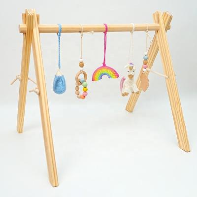 China Baby Educational Gym Unicorn Wooden Sensory Hanging Toys Rattle Toy Rainbow Teething Rings Crochet for sale