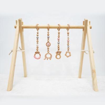 China Hanging Wooden Activity Gym Toys Baby Crochet Toy Baby Gymnasium Educational Soft Play Gymnasium for sale