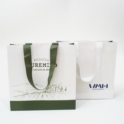 China Recycled Materials Customized Paper Bags Gift Bags High Quality Paper Bags With Colorful Hand Strings for sale