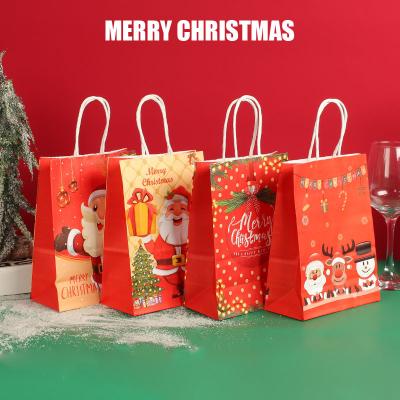 China Recyclable Custom Print Paperboard Bags Santa Pattern Red Gift Packaging Eco-friendly Recycled Merry Christmas Paper Gift Bag for sale