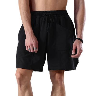 China Anti-Wrinkle Mens Gym Sports Workout Shorts Patchwork Drawstring Multi Pocket Training Joggers Shorts Elastic Waist Running Shorts for sale