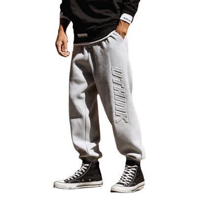 China Anti-wrinkle fashion streetwear men's casual plus size track pants 3D printing men's fleece joggers embossed pants for sale