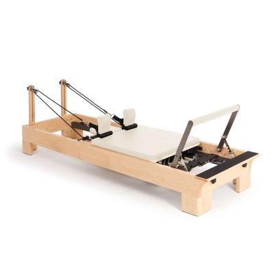 China Bodybuidling Yoga Studio Fitness Pilates Equipment Maple Wood Pilates Reformer for sale