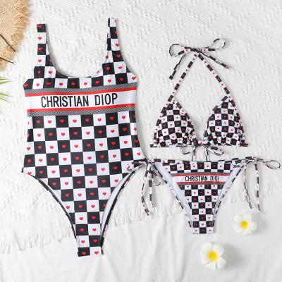 China Sexy printed one-piece swimsuit women lace up side thong swimsuit women summer windproof bikini suit for sale