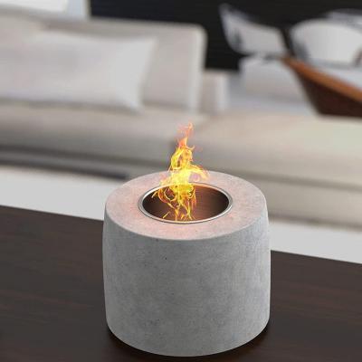 China Amazon hot sale round shape stocked concrete fire pit fireplace fireplace for tabletop use for sale