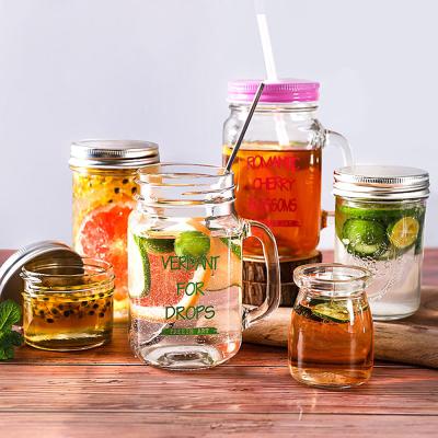 China Wholesale Custom 12oz 16oz 18oz Minimalist Clear Mason Jar Bulk Glass Mason Jars With Handle And Lid for sale