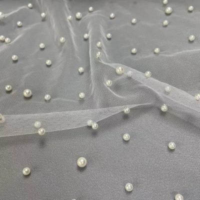 China Anti-Static NO MOQ Ivory Pearl Tulle Fabric Beaded Lace Fabric Bridal Lace Beaded Fabric For Dress for sale