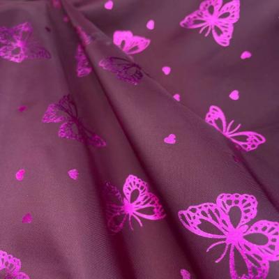 China 100%polyester 210T waterproof taffeta PU coated with foil butterfly design waterproof fabric for garment for sale