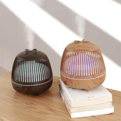 China 2021 Household Bestselling Birdcage 550ML Essential Aromatherapy Wood Diffuser Oi Fragrance Diffuser Wood Grain Air Humidifier for sale