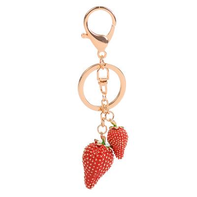 China Fashion Strawberry Peach Shape Fashion Rhinestone Car Handbag Key Chain Pendant Lover Gifts For Women Pinch Charms Key Ring for sale