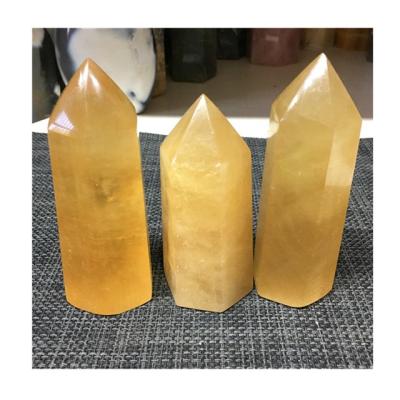 China Europe natural crystal honey wholesale calcite point tower crystal volume for home decoration for sale