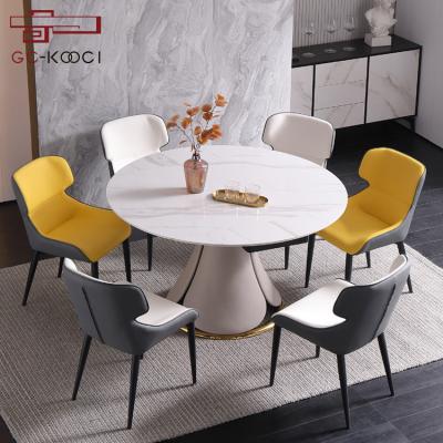 China Nordic White Marble Round Extendable Dining Table Set Convertible Chipboard Stone Dining Table 6 Chairs for sale