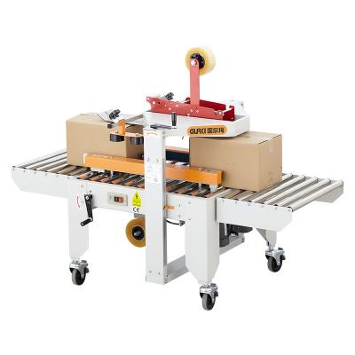 China Manual End Sealer Machine Carton Food Box Box End Sealer Machine With Strip for sale