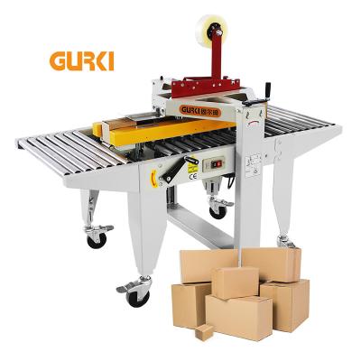 China Small food box taping to case packaging machine carton sealing machine automatic box sealer for sale