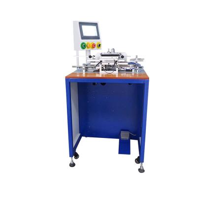 China Automatic stick high temperature strip on battery WL-150C automatic lead acid battery streatch wrapping machine for sale