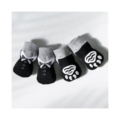 Chine Chaussettes noires pour chiens Protection de haute qualité Confort Collage pour les pieds Chaussettes pour les oreilles pour animaux à vendre