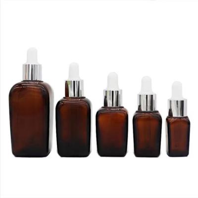 China 10ml 20ml 30ml 50ml 100ml High Quality Cosmetic Amber Essential Oil Bottle Empty Glass Square With Dropper Cap for sale