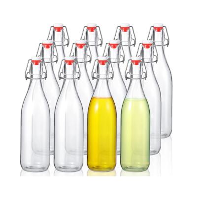 China Empty Beverage Clear Fruit Juice Beverage Swinging Top Glass Bottle 250ml 500ml 750ml 1000ml for sale