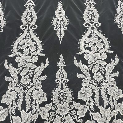 China Viable wholesale white embroidery lace bridal fabric on dress for sale