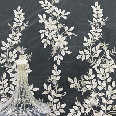 China OEM Sustainable Wedding Bridal Lady Dress White Sequins Tying Embroidery Lace Fabric for sale