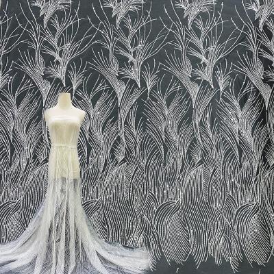 China Viable Customize Luxury Sequin String Bead Embroidery Bridal White Wedding Lace Dress Fabric for sale