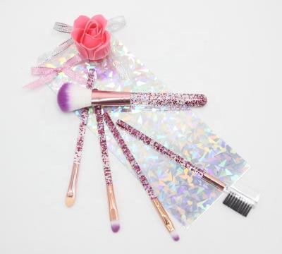 China Fan Brush 2022 Amazon Best Seller Travel Make Up Brush With Bag Wholesale Price Multicolor Bling Quicksand Makeup Brushes for sale