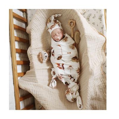 China Soft Special Hot Selling Organic 100% Cotton Muslin Print Baby Wrap Set With Hat for sale