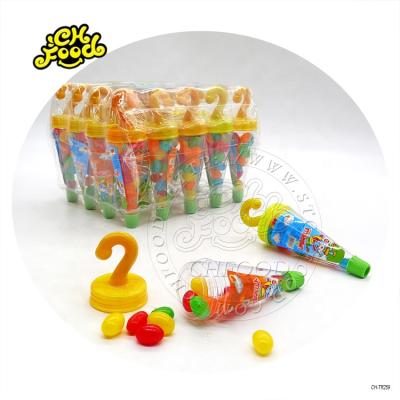 China Cartoon Toys Wholesale Plastic Umbrella Toy With Jelly Bean Inside Fruit Flavor Candy for sale