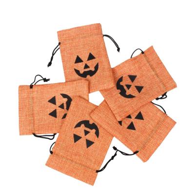 China Factory Hot Sale Eco-friendly Halloween Bags With Funny Face Pattern Drawstring Bag Custom Halloween Candy Bag for sale