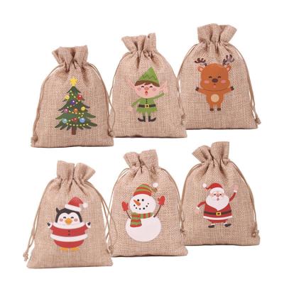 China Factory Wholesale Eco-Friendly Logo Snowman Pattern Festival Gift Jute Pouch Christmas Jute Bags Custom Made With Logo for sale