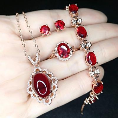 China FASHIONABLE Luxury Rose Gold Garnet Diamond Earrings Necklace Rings Crystal Red Bracelet Four Pieces Jewelry Set for sale