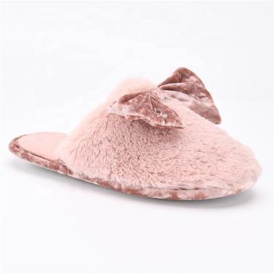 China Anti-slippery Christmas gift factory wholesale fashion trend slip pink women girls indoor fur slippers with bow for sale