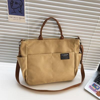 China Cheap Korean Simple Tote Shopping Bag Large Canvas Fashion Pocket Bag Women Multi Shoulder Bag for sale