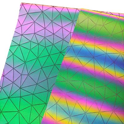 China Anti-Mildew Triangle Pattern Embossed UV Color Change PU Bright Light Colored Reflected Faux Leather Fabric For Bags Crafts Decoration for sale