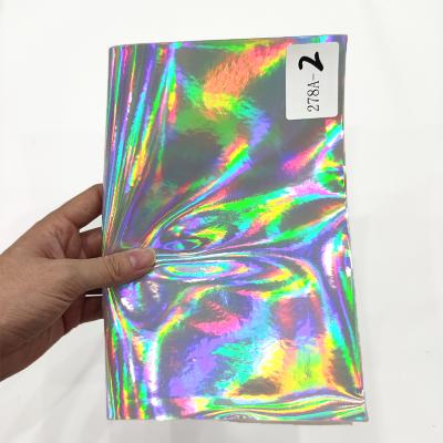 China Waterproof Manufacturer Hologram Metallic Glossy PU Sheet Cotton Synthetic Leather Backing For Making Bags/Accessories for sale