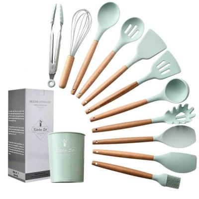 China Sustainable Kitchen Utensils Set With Wooden Rack 11 PCS Heat Resistant Silicone Cookware Set Non Toxic Eco-Friendly Kitchen Tools for sale