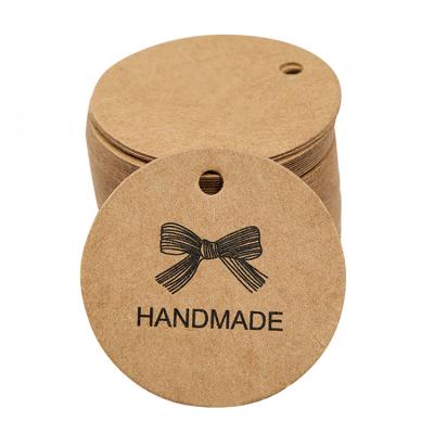 China Custom Original Recycled Kraft Paper Hang Tag Swing Tag With Company Logo Printing for sale